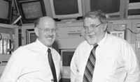 Jonathan Dorfan(left), director at SLAC, and John O'Fallon, of DOE, visit the main control room as they tour Fermilab