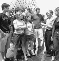 QuarkNet Staff member Patrick Mooney tells his QuarkNet students about Fermilab's mission.