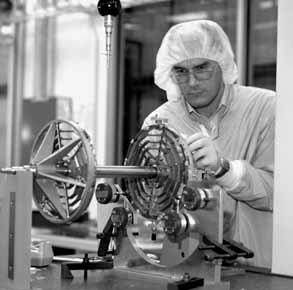 Cristian Gingu, inspects the bulkheads for the SVXII Detector