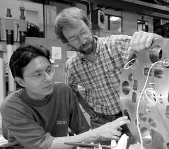 Tug Arkan(here with Rodger Bossert,right) has worked on the LHC magnet design