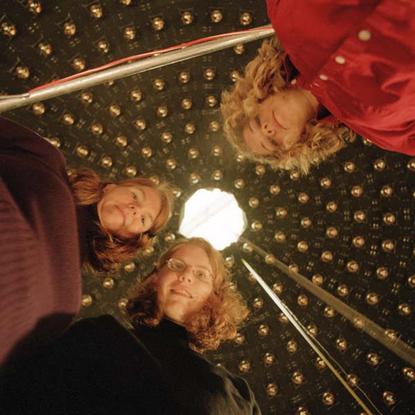 (L-R): Janet Conrad, Bonnie Fleming and Jennifer Raaf at the bottom of the MiniBooNE detector. The 250,000-gallon detector is now filled with ultraclean mineral oil and recorded its first neutrino event on Sept. 9. Around 25 NuCosmo participants signed up for a tour of the MiniBooNE facilities, even though the experiment is taking data and everything is closed up.