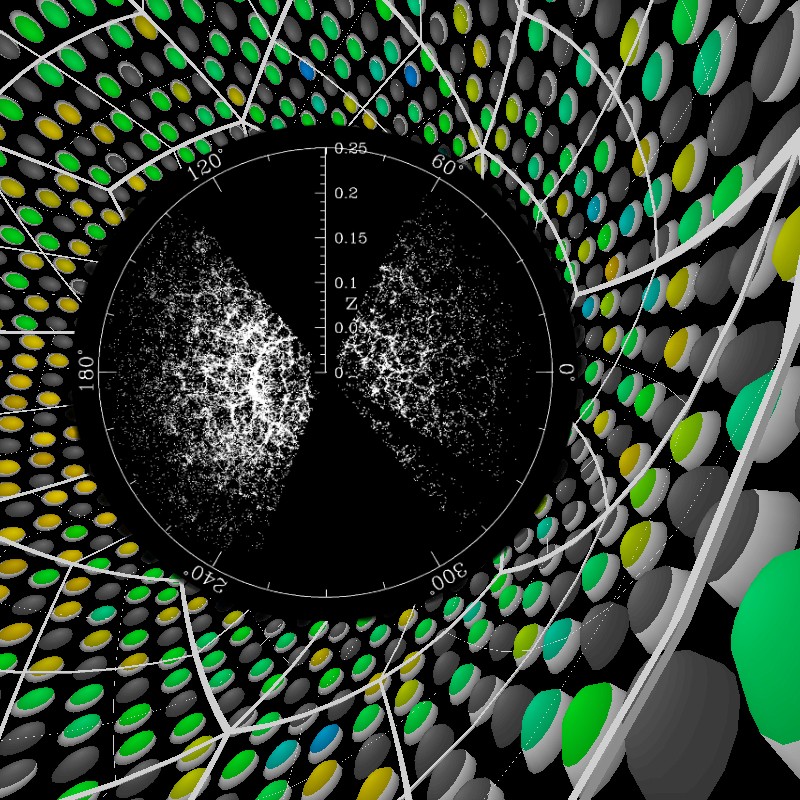 This image is a combination of a depiction of the first event in the KamLAND detector and the equatorial distribution of a small fraction (about 60,000) of the latest main galaxy sample of the Sloan Digital Sky Survey.