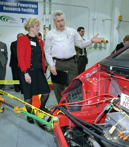 Rep. Biggert and Bob Larsen, director of Argonne's Center for Transportation Research, view a gasoline-electric hybrid vehicle whose technology is being studied.