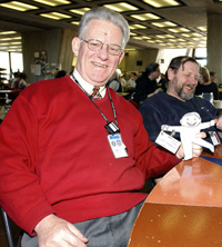 Flat Stanley has lunch in the cafeteria with physicist, Chuck Brown.