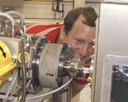 Jerry Zimmerman inspects connections at the plastic extrusion line.