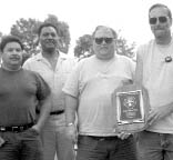 Business Services Section employees Tony Villa, Dwayne Foster, Ken Peterson and Wayne Smith display their section's `Most Improved' safety award.