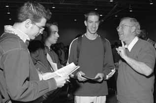  Fermilab physicist Dave Finley(right) shares his view of science with Proviso West students